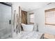 Spa-like bathroom featuring a soaking tub, modern fixtures, and a glass shower at 4956 Waterside Cir, Carmel, IN 46033