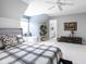 Bright bedroom with a gray bed, built in window bench, and neutral carpet at 4956 Waterside Cir, Carmel, IN 46033