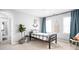 Bedroom features modern decor, light gray walls, and an abundance of natural light at 4956 Waterside Cir, Carmel, IN 46033