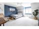 Cozy bedroom featuring blue accent wall, gray bed frame and decor, with plush carpet at 4956 Waterside Cir, Carmel, IN 46033
