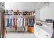 Spacious closet with custom shelving, hanging racks, and built-in drawers at 4956 Waterside Cir, Carmel, IN 46033