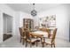 Bright dining room with a decorative light fixture, ample seating, and stylish decor at 4956 Waterside Cir, Carmel, IN 46033