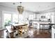 Bright kitchen featuring a granite countertop island, stainless steel appliances, and dining space at 4956 Waterside Cir, Carmel, IN 46033
