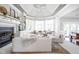 Bright and airy living room with a fireplace, built-in shelving, and panoramic views at 4956 Waterside Cir, Carmel, IN 46033