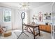 Bright home office with modern lighting, shelving, and a large work space at 4956 Waterside Cir, Carmel, IN 46033
