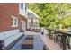 Cozy outdoor patio with furniture, a blue rug, and views of the lush backyard, offering a great space to unwind at 4956 Waterside Cir, Carmel, IN 46033