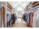 Well-organized walk-in closet with shelving, hanging racks, and storage for accessories at 4956 Waterside Cir, Carmel, IN 46033