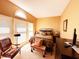 Cozy bedroom featuring large windows, comfortable seating, and modern furnishings at 5190 Pursel Ln, Carmel, IN 46033
