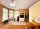Spacious bedroom showcasing a ceiling fan, multiple windows, and a cozy, well-lit atmosphere at 5190 Pursel Ln, Carmel, IN 46033
