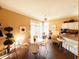 Cozy breakfast nook with bright windows, a ceiling fan, and hardwood floors at 5190 Pursel Ln, Carmel, IN 46033