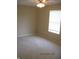 A bedroom with neutral carpet, walls, ceiling fan and natural light at 533 Charnwood Pkwy, Beech Grove, IN 46107