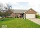 Charming one-story brick home with well-manicured lawn and an attached two-car garage at 533 Charnwood Pkwy, Beech Grove, IN 46107