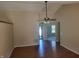 Open living room with high vaulted ceilings and wood look floors at 533 Charnwood Pkwy, Beech Grove, IN 46107