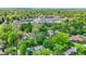 Aerial view showcasing the property's proximity to a school, sports fields, and lush green neighborhood at 5840 Brouse Ave, Indianapolis, IN 46220