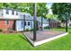 Backyard featuring a wooden deck, grill, and lush green lawn, perfect for outdoor dining and entertainment at 5840 Brouse Ave, Indianapolis, IN 46220