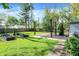 Lush backyard with a deck, garden beds, and a well-maintained lawn, creating a serene outdoor space at 5840 Brouse Ave, Indianapolis, IN 46220