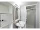 Functional bathroom featuring a pedestal sink, classic fixtures, and a glass-enclosed shower at 5840 Brouse Ave, Indianapolis, IN 46220