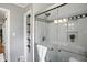 Bathroom with a glass-door shower, tiled walls, and sleek fixtures, combining functionality and style at 5840 Brouse Ave, Indianapolis, IN 46220