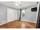Bedroom featuring hardwood floors, a window, and a closet with built in drawers at 5840 Brouse Ave, Indianapolis, IN 46220