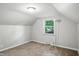 Bright, neutral carpeted bedroom featuring a window for natural light, and outlets for convenience at 5840 Brouse Ave, Indianapolis, IN 46220