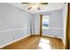 Bedroom with hardwood floors, ceiling fan, and closet at 5840 Brouse Ave, Indianapolis, IN 46220