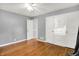 Bedroom features hardwood floors, a closet with built in drawers, and an open door at 5840 Brouse Ave, Indianapolis, IN 46220