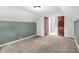 Bedroom with carpet and paneled door at 5840 Brouse Ave, Indianapolis, IN 46220
