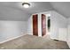 Neutral bedroom with plush carpet, closet, and paneled door at 5840 Brouse Ave, Indianapolis, IN 46220
