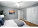 Comfortable bedroom with hardwood floors, built-in storage, and ample natural light at 5840 Brouse Ave, Indianapolis, IN 46220
