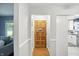 Inviting entryway with hardwood floors and a beautiful wooden front door, leading into a modern home at 5840 Brouse Ave, Indianapolis, IN 46220