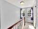 Hallway with two windows, carpet and railing at 5840 Brouse Ave, Indianapolis, IN 46220