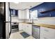 Bright kitchen featuring white cabinets, stainless steel appliances, and beautiful butcher block countertops at 5840 Brouse Ave, Indianapolis, IN 46220