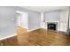 Inviting living room with hardwood floors, fireplace and built-in shelving at 5840 Brouse Ave, Indianapolis, IN 46220