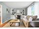 Bright living room with a cozy fireplace, built-in cabinets, and neutral decor at 5840 Brouse Ave, Indianapolis, IN 46220