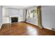 Comfortable living room with hardwood floors and a classic fireplace at 5840 Brouse Ave, Indianapolis, IN 46220