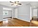 Spacious living area featuring gleaming hardwood floors and neutral walls at 5840 Brouse Ave, Indianapolis, IN 46220