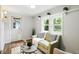 Cozy living area with a comfortable sofa, ample windows, and stylish decor at 5840 Brouse Ave, Indianapolis, IN 46220