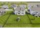 Aerial view of backyard featuring a fenced yard and playset, with a house in the background at 6101 Hardwick Dr, Whitestown, IN 46075