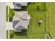 Top-down aerial of backyard with green lawn and playground, along with the home and roof at 6101 Hardwick Dr, Whitestown, IN 46075