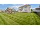 A beautifully maintained backyard features a playset and lush lawn, perfect for relaxation and play at 6101 Hardwick Dr, Whitestown, IN 46075