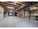 Unfinished basement offers potential for customization with exposed ductwork and concrete flooring at 6101 Hardwick Dr, Whitestown, IN 46075