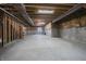 Vast unfinished basement with exposed insulation, utility, and concrete flooring ready for customization at 6101 Hardwick Dr, Whitestown, IN 46075