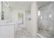 Bright bathroom featuring double sink vanity and a glass shower with decorative tile work at 6101 Hardwick Dr, Whitestown, IN 46075