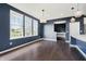 Dining area with stylish lighting, large windows, and hardwood flooring for elegant entertaining at 6101 Hardwick Dr, Whitestown, IN 46075