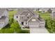 Aerial view of home with nice curb appeal, two-car garage, and manicured lawn at 6101 Hardwick Dr, Whitestown, IN 46075
