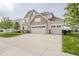 Charming two-story home featuring a large driveway and well-maintained lawn at 6101 Hardwick Dr, Whitestown, IN 46075