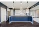 Kitchen features an island with seating, pendant lighting and modern stainless steel appliances at 6101 Hardwick Dr, Whitestown, IN 46075