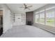 Bright living room featuring a fireplace, custom built-ins, and a ceiling fan at 6101 Hardwick Dr, Whitestown, IN 46075