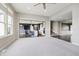 Open-concept living area boasting neutral decor and abundant natural light that leads to kitchen and stairs at 6101 Hardwick Dr, Whitestown, IN 46075