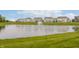 Community with serene pond featuring fountain and well-manicured landscaping at 6101 Hardwick Dr, Whitestown, IN 46075